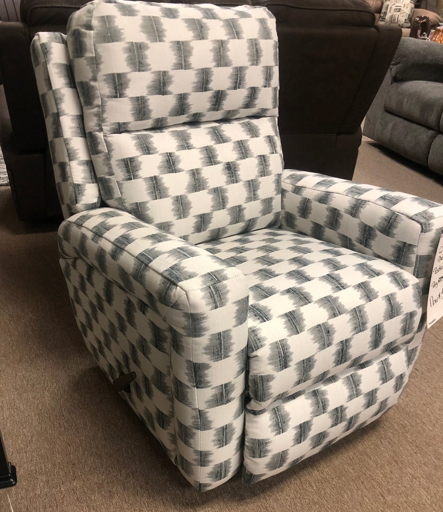 Rocker recliner with handle on the side.